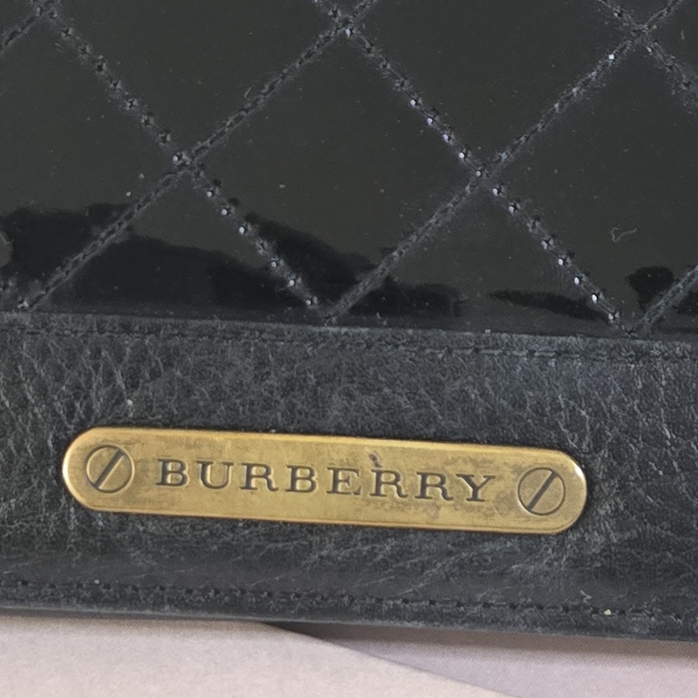 Burberry Black Quilted Leather Accessory With Gold Accent